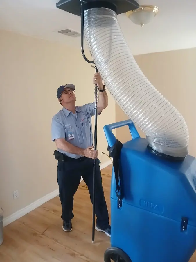 Furnace Tune-Up technician using HEPA equipment in EspaÃ±ola